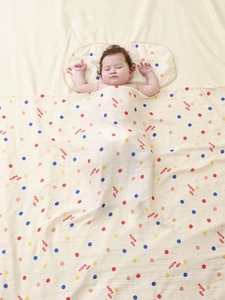 Bamboo cotton gauze baby blanket with colorful polka dots and infant pillow set