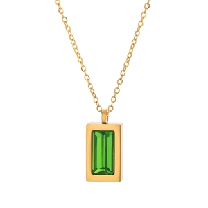 Detail of a gold necklace featuring a rectangular green gemstone pendant on white background
