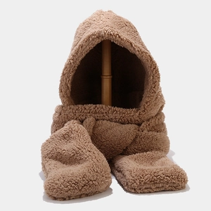 Detail of soft brown plush hooded scarf with integrated gloves and warm fuzzy texture