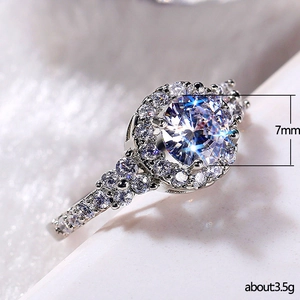 Elegant round zircon cluster ring in silver finish with 7mm center stone and 3.5g weight
