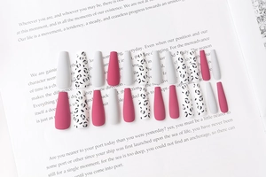 Detailed set of 24 matte rose pink and leopard print long coffin press-on nails on a book