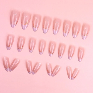 Long almond press-on nails with nude pink base, purple French tips and gold glitter marble