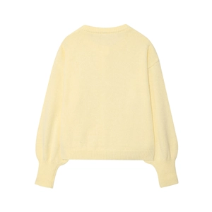 Pale yellow knit sweater featuring round neck and ribbed cuffs on plain background