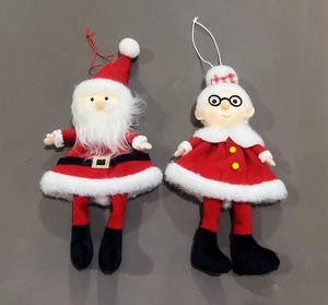 Detail of plush Santa and Mrs. Claus hanging ornaments with festive felt texture