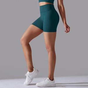 Detail of high waisted seamless dark green sports shorts with wide ribbed waistband