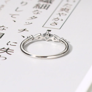 Macro view of silver crown ring with cubic zirconia paving and fine jewelry craftsmanship