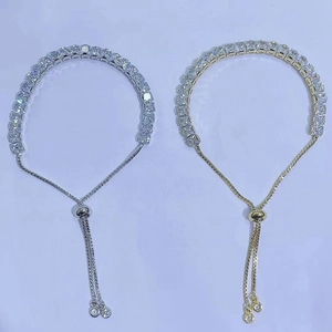 Detail of adjustable tennis bracelets with square-cut cubic zirconia in gold and silver
