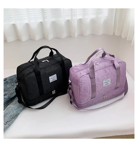 Detail view of large fitness bag with embossed stars pattern and shoe compartment