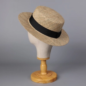 Handwoven flat top straw hat for women with black ribbon trim for beach vacation