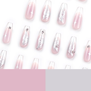 Pink gradient coffin nails with silver butterfly, star patterns and rhinestones