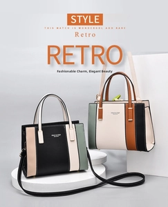 Detail view of two large-capacity contrast color tote bags on geometric display stands