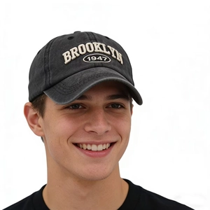 Vintage washed Brooklyn 1947 embroidered cotton baseball cap worn by male model