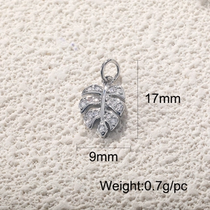 Macro shot of silver leaf pendant with small diamonds and 17x9mm size dimensions