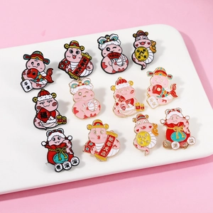 Detailed arrangement of cartoon snake pins with festive Chinese New Year elements