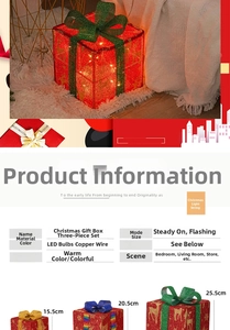 Close-up of three lighted Christmas gift boxes in red glitter with colorful bows