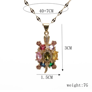 Detail view of colorful turtle pendant necklace showing dimensions 3x1.5cm and 40+7cm chain