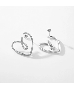 Macro detail of S925 silver heart earrings with micro-pave crystals and secure pin back