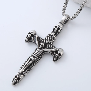 Macro view of a Gothic skull cross pendant in retro silver stainless steel for men