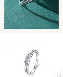 Detail of S925 sterling silver ring featuring a micro-set crystal cross on double bands