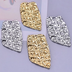 Detail of irregular textured 304 stainless steel pendants in gold and silver finish