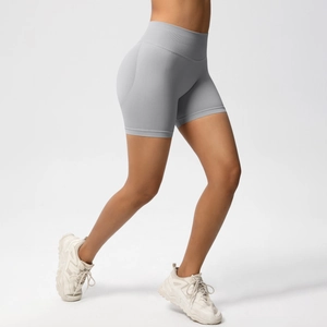 Side view of seamless high waist light grey workout shorts with peach lift effect