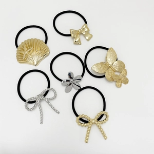 Detailed set of six hair ties featuring gold and silver metal butterfly and shell charms