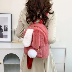 Cute pink plush rabbit backpack with long white ears and adjustable straps for girls