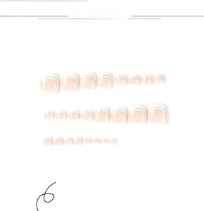 Flat lay of 24 pieces of white French tip press-on toenails in various sizes