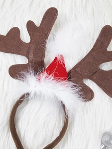 Festive reindeer antlers headband with a red Santa hat on a white plush background