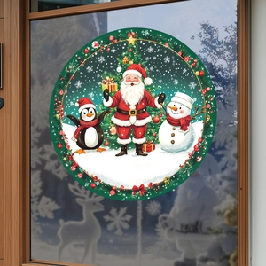 Macro detail of a round Santa Claus and penguin window sticker for Christmas home decor