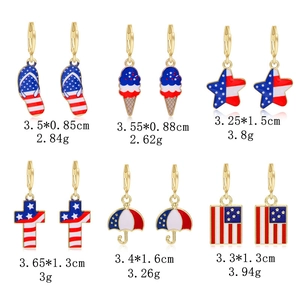 Detailed view of six USA flag themed earrings with red white and blue enamel patterns