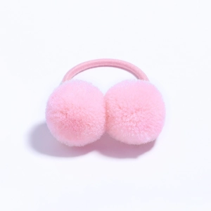 Detailed view of pink fuzzy pom pom hair ties with elastic bands for children's hairstyling