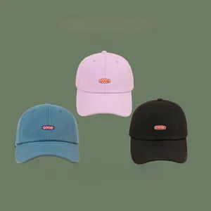 Detailed comparison of pink, blue, and black cotton baseball caps with GOOD embroidery