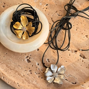 Long adjustable flower pendant necklace in 18k gold and silver with black woven cord