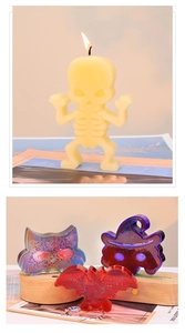 Close-up of glitter Halloween resin figurines showing skeleton, bat and ghost details
