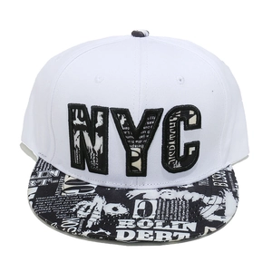 Close-up of black and white graffiti embroidery on a white flat brim snapback cap
