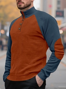 Detail of color-block knit sweater with button collar and elbow patches for men