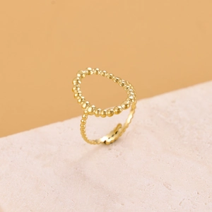 Detail of a gold stainless steel ring with a unique beaded hollow-out open design