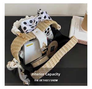 Top view of straw handbag showing spacious interior with phone and cosmetics