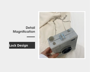 Detail magnification of silver glitter camera-shaped bag with metal lock and chain
