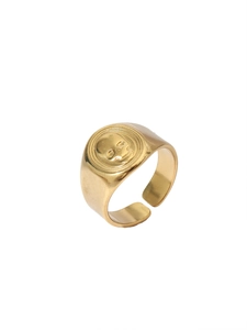 Detailed view of the vintage skull relief and open-ended design of the 18k gold-plated ring