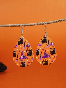 Halloween drop earrings with black cat and wizard hat motifs on orange leather texture
