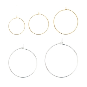 Polished gold and silver DIY jewelry hoop earring components in five sizes on white background