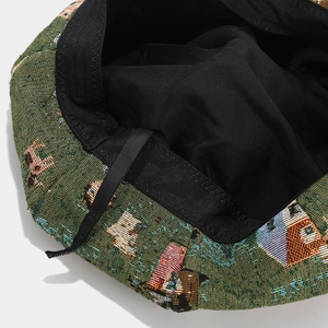 Detail of vintage jacquard pattern and premium black lining on painter hat