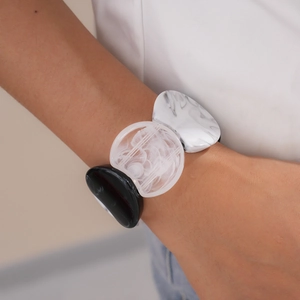 Detail of vintage acrylic geometric bracelet with marble pattern on model's wrist