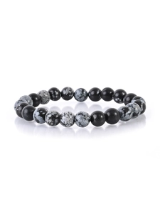 Macro shot of 8mm natural snowflake obsidian and black onyx beaded bracelet detail