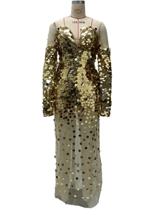 Detail of gold sequins on mesh evening gown featuring high-shine metallic texture