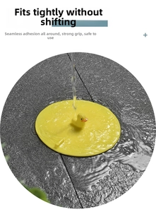 Close-up of yellow duck silicone floor drain cover with tight suction on tiled floor
