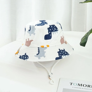 White kids bucket hat with dinosaur prints and adjustable drawstring for sun protection