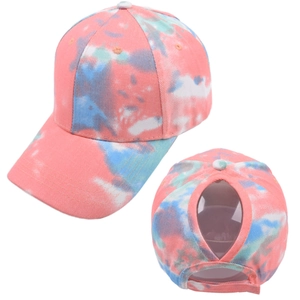 Detail of the tie-dye baseball cap featuring a convenient ponytail hole at the back